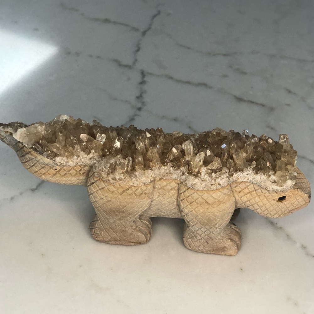 Leo the hand carved dinosaur made of quartz